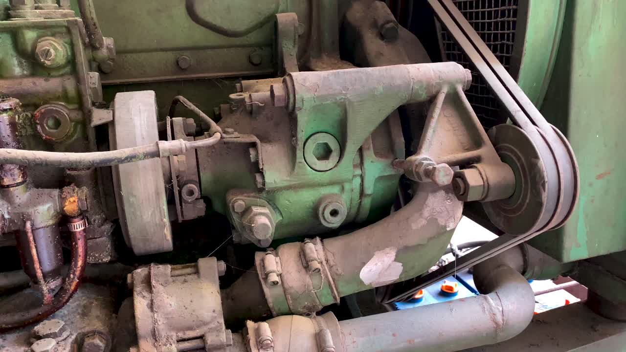 Detail shot of old emergency diesel generator with seeping oil