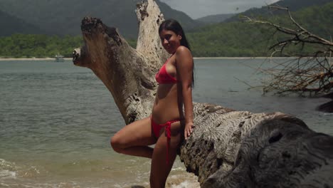 a young latin lady in a bikini, immersed in the idyllic beauty of a tropical caribbean beach.