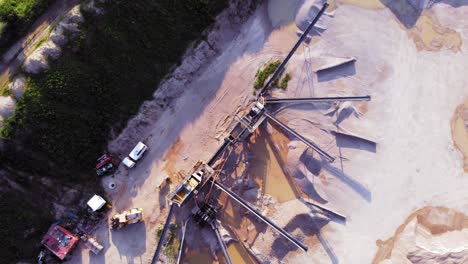 aerial above shot from a drone of quarry and heavy machinery in pomeranian district in poland