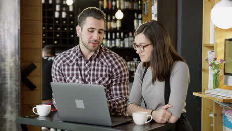 couple working together on laptop in