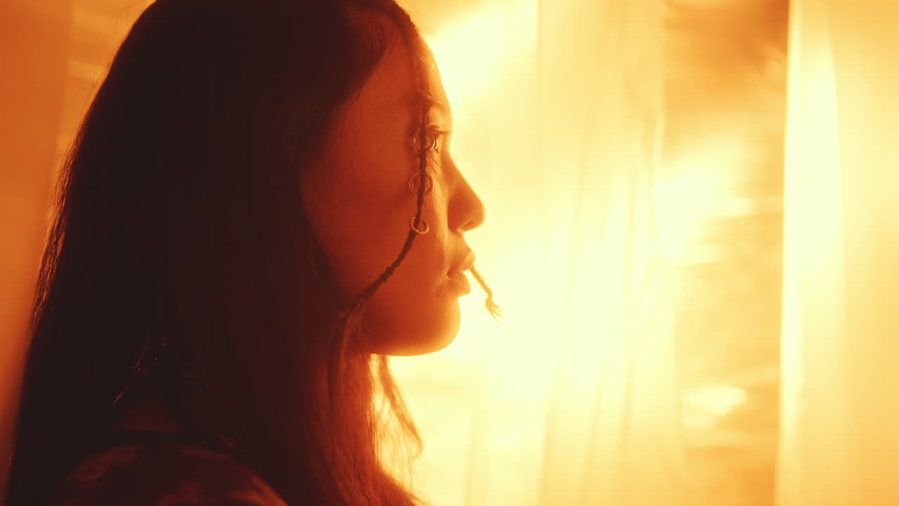 Portrait of Charming Asian Woman in Glowing Golden Light