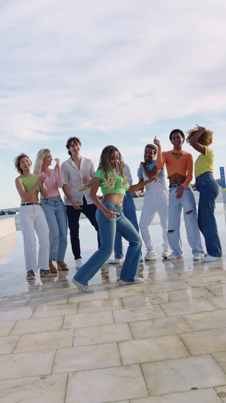 Group of young people dancing outdoors