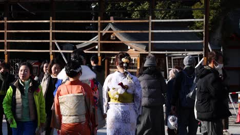 bride in kimono with attendees at shinto shrine