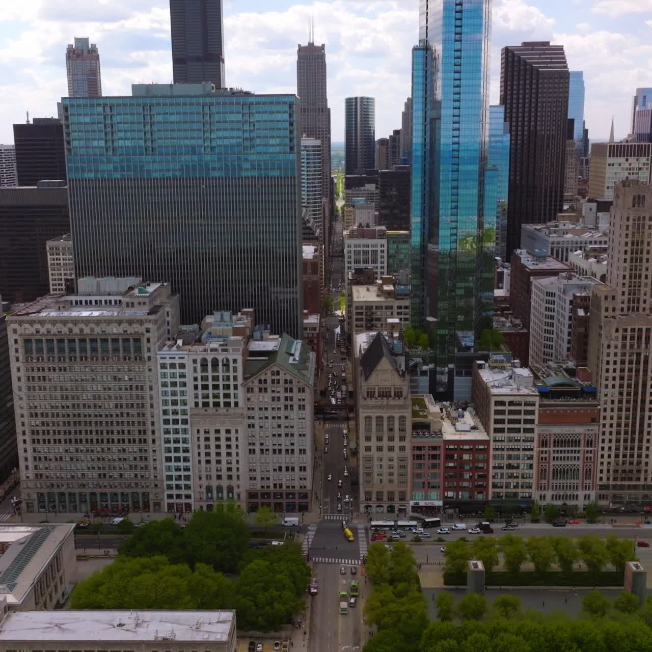 Narrow street going between the gorgeous architecture. Amazing Millennium Park with Jelly Bean sculpture. Chicago, Illinois