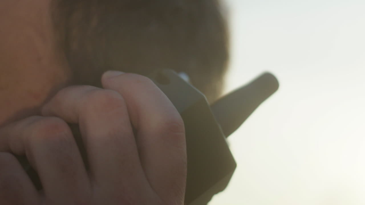 Person using a walkie-talkie
