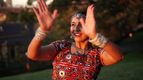 Woman-Dancing-Classical-Traditional-Indian-Dance-In-A-Garden-In-Sydney,-Australia---medium-shot