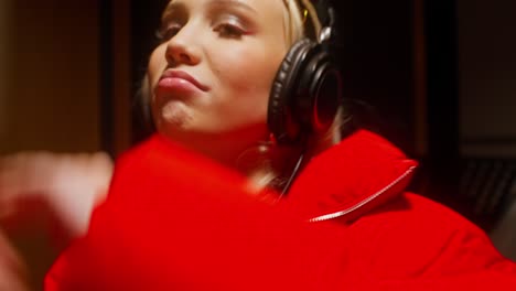 woman singing in recording studio