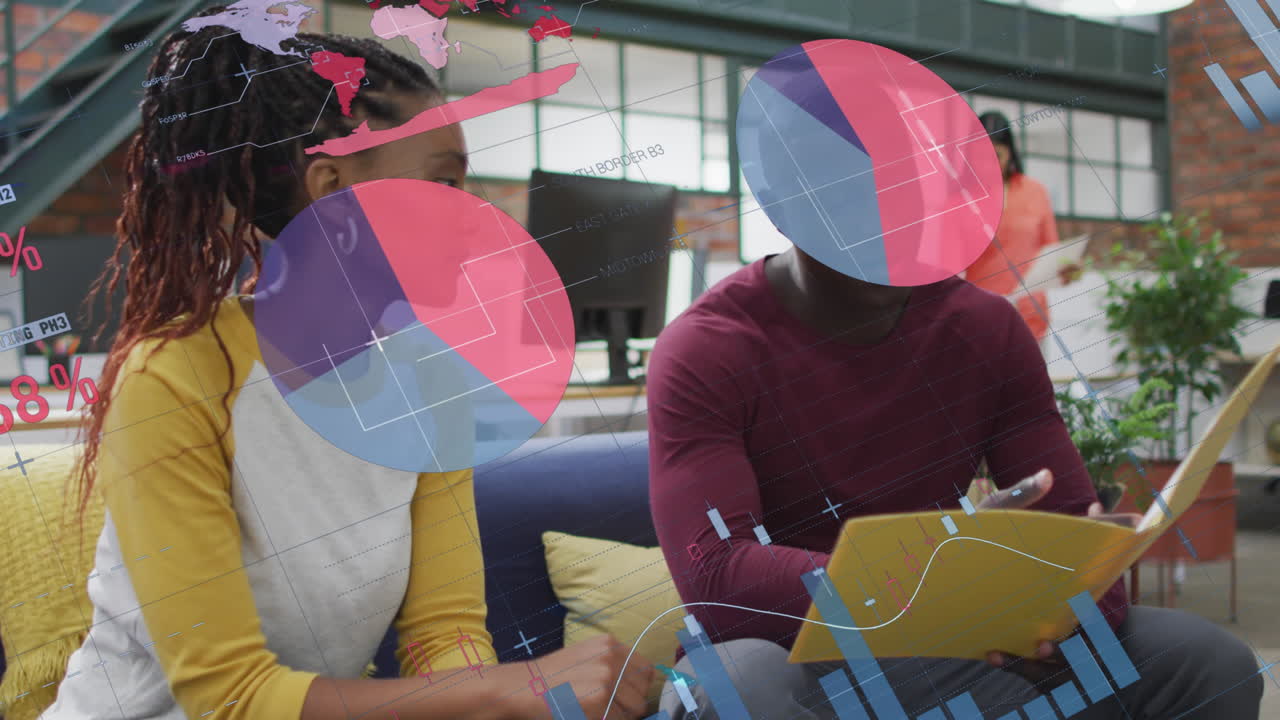 Animation of infographic interface over diverse coworkers discussing reports in office