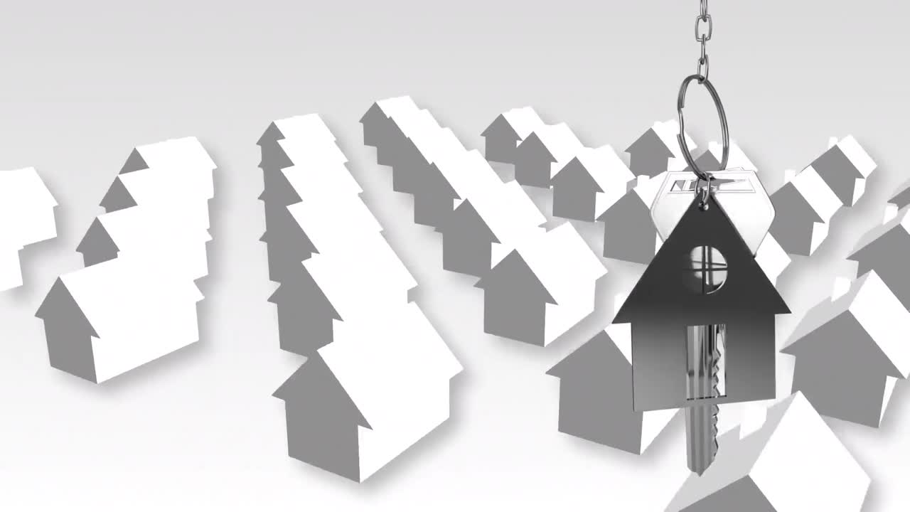 chiavi di casa e portachiavi appesi su modelli di case 3d sullo sfondo