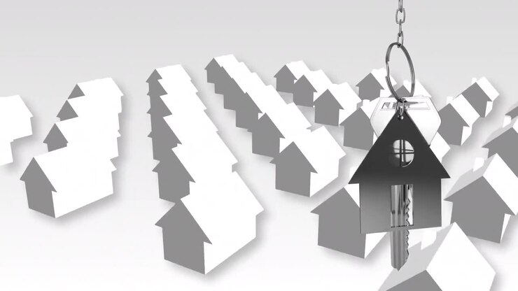 Hausschlüssel und Schlüsselanhänger hängen über 3D-Hausmodellen im Hintergrund