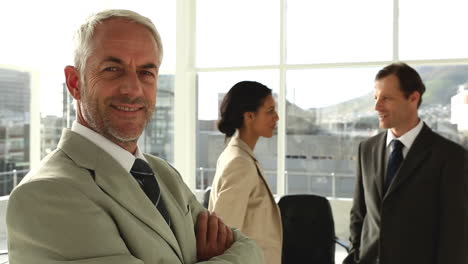 confident businessman standing in office