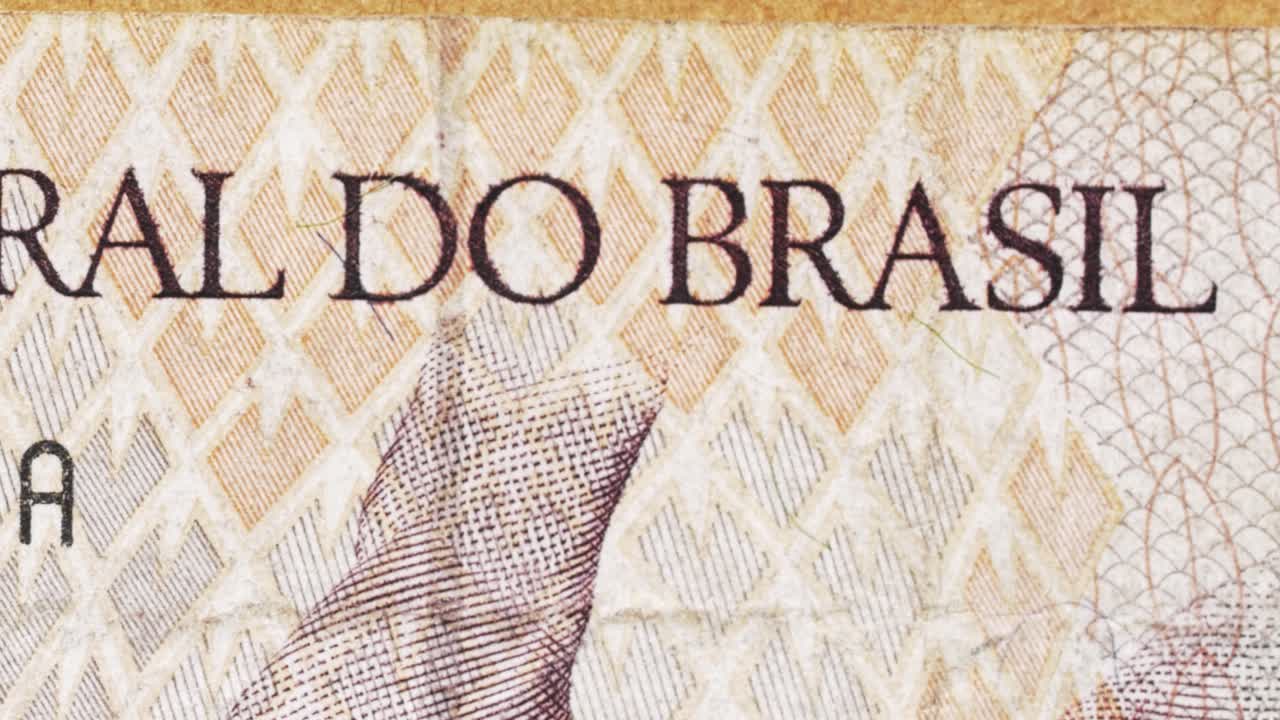 Macro pan across Banco Central do Brasil text on a Brazilian banknote