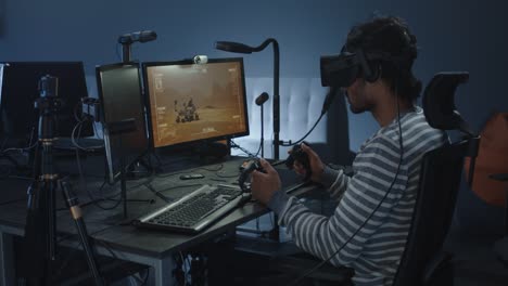 person using vr headset for space simulation game on a computer