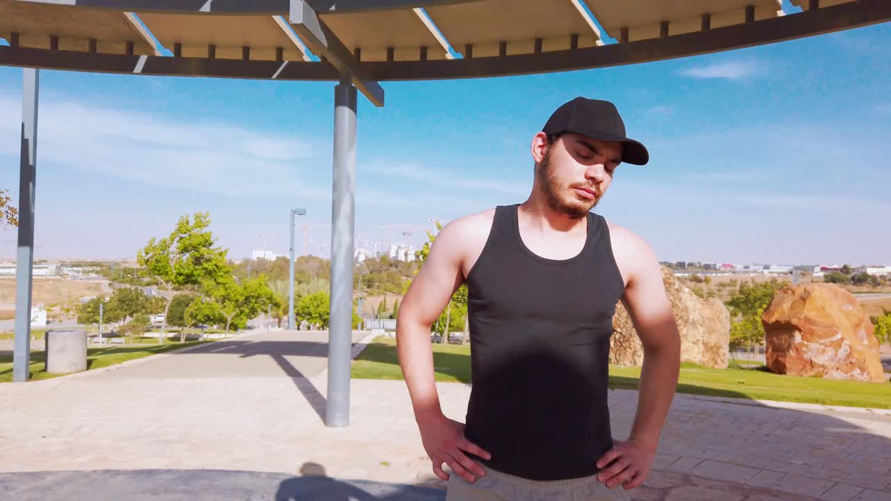 Young men warming up exercises, neck muscle stretching.
