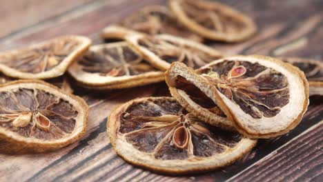 dried citrus slices on wooden background