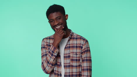 Cheerful-bearded-african-american-man-fashion-model-in-casual-shirt-smiling-and-looking-at-camera