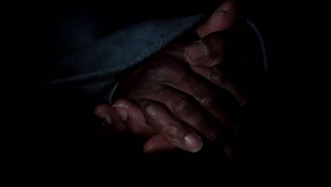 man-praying-to-god-with-hands-together-Caribbean-man-praying-with-black-background-stock-footage