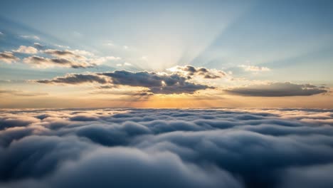 radiant sunset above a sea of clouds with golden sunrays