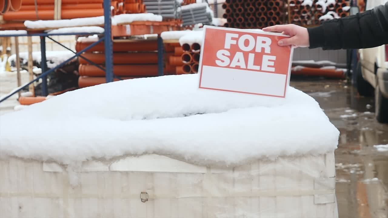 Orange PVC pipes stacked in construction site
