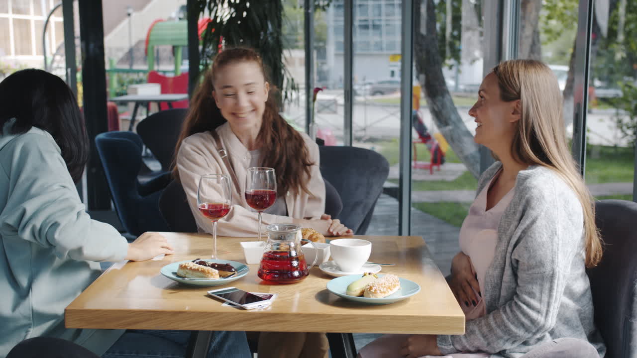 Friends celebrating at a cafe