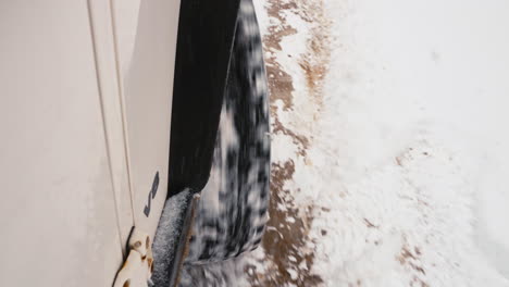 suv wheel burning out on snow covered muddy terrain unable to take off