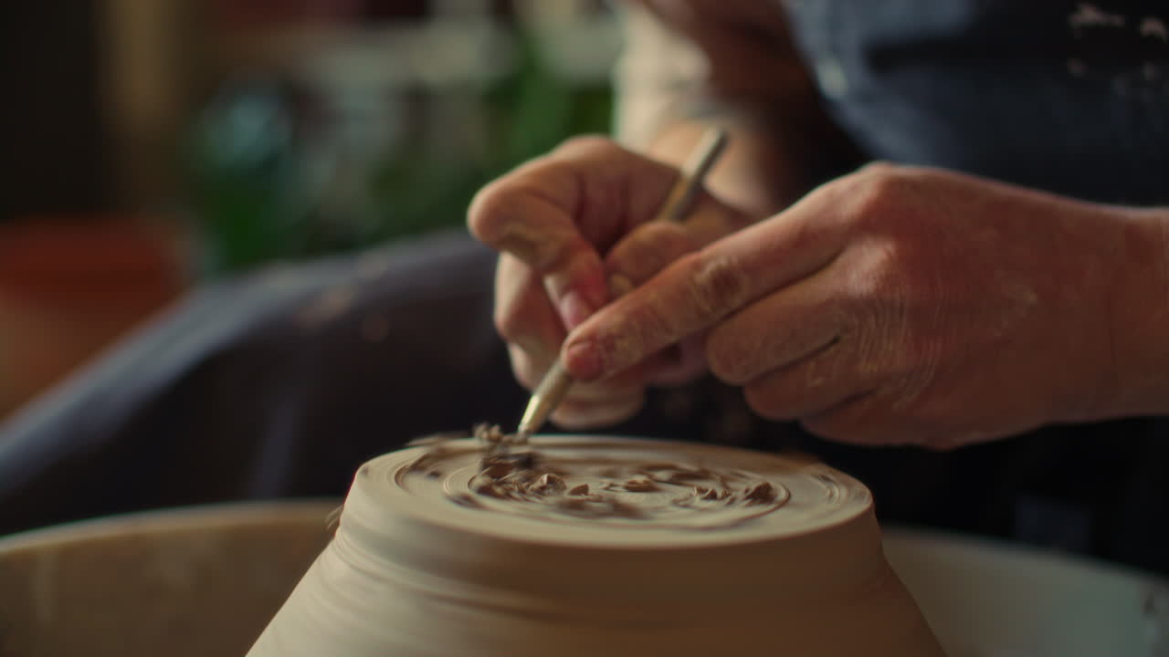 Close Up of Creating Foot Ring on Bottom of Clay Pot with Loop Tool