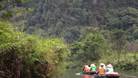 group of people rafting down a tranquil river