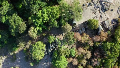 drone ascending and showing the prehistoric rock formations of beglik tash sanctuary, the oldest and largest thracian sanctuary in eastern bulgaria