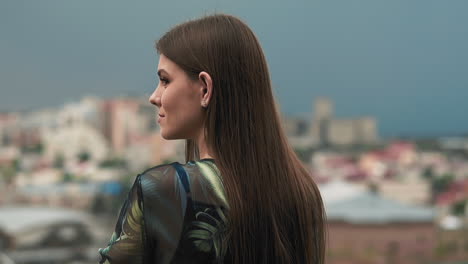 Happy-woman-tourist-enjoys-large-city-view-on-spring-day