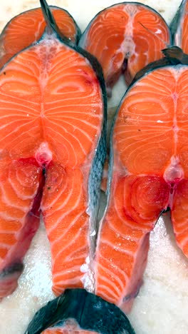 fresh salmon slices displayed at a market