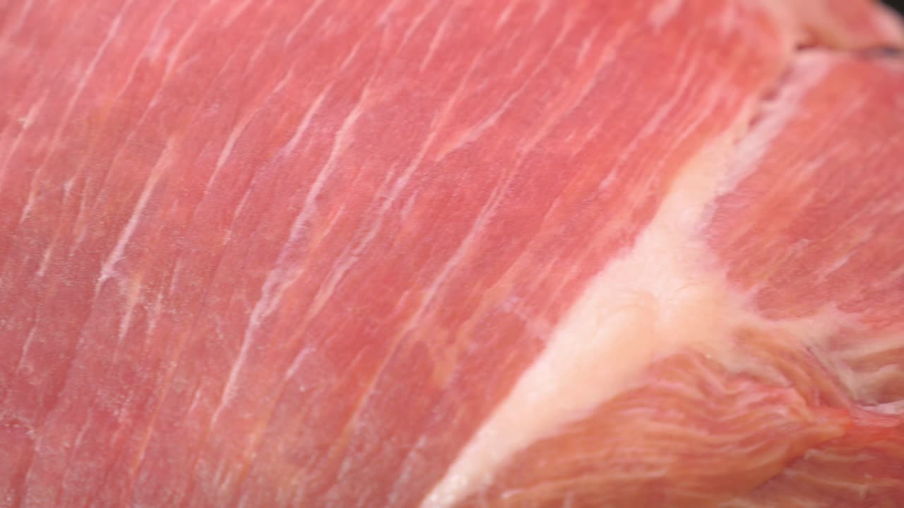 Close-up view of raw ham