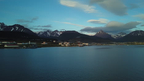 wonderful time lapse shot with movement of a sunset in ushuaia argentina with clouds over the mountains