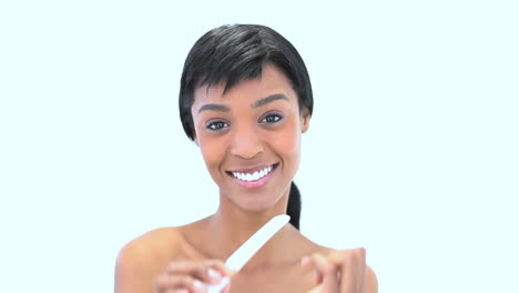 cheerful woman filing her nails