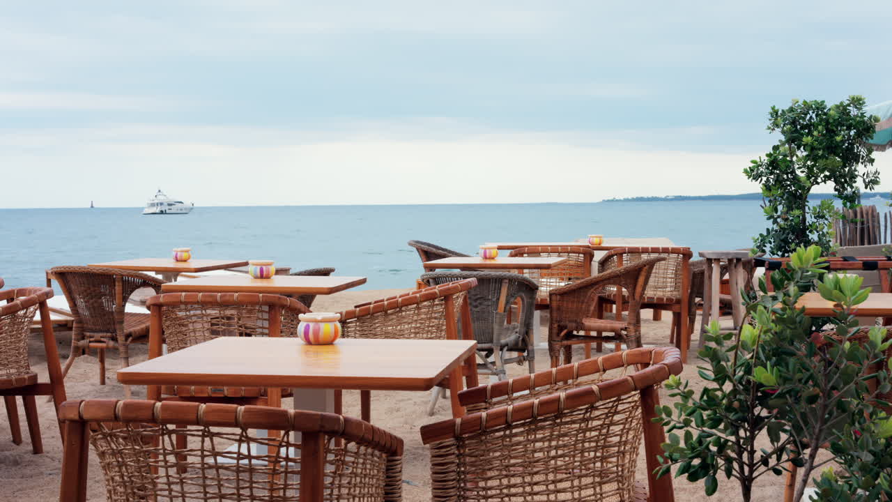 Empty tables at a beach terrace in the evening