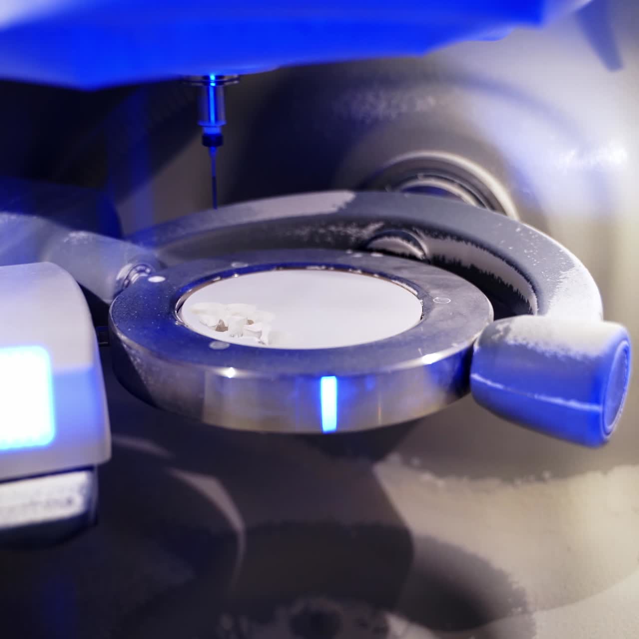 Dentistry. Dental milling machine working creating implants and human teeth carving out of ceramics. Industrial revolution. Technologies