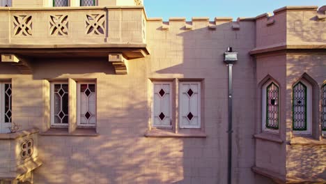 Boom-up-of-window-and-balcony-design-with-fluted-or-flower-shapes-at-the-Sermini-Castle,-Tudor-architecture-with-eclectic-style,-Santiago-Chile