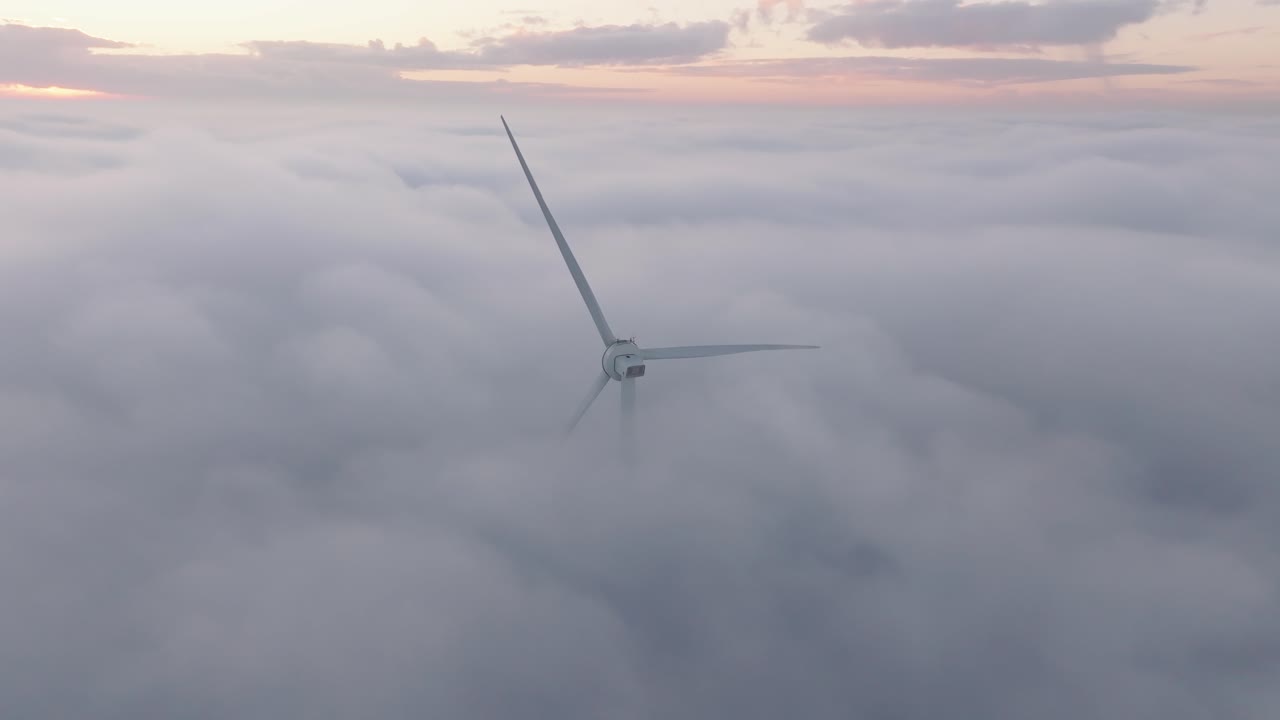 Drone shot of a Windturbine in foggy conditions