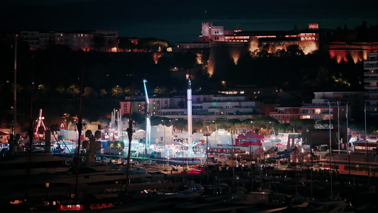 Aerial view of the Port Hercule Funfair in Monaco at night