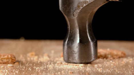 hammer smashing biscuits on table