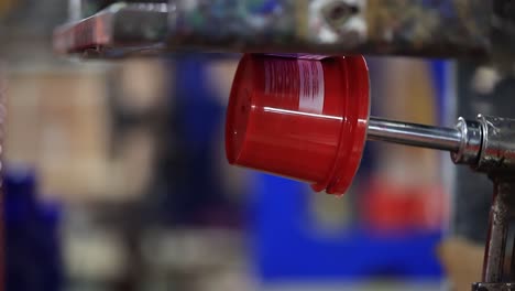 man put a grease bowl in sticker machine, industry 5.0