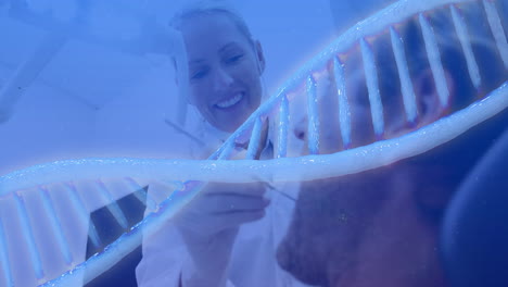 dna strand animation over smiling scientists conducting research