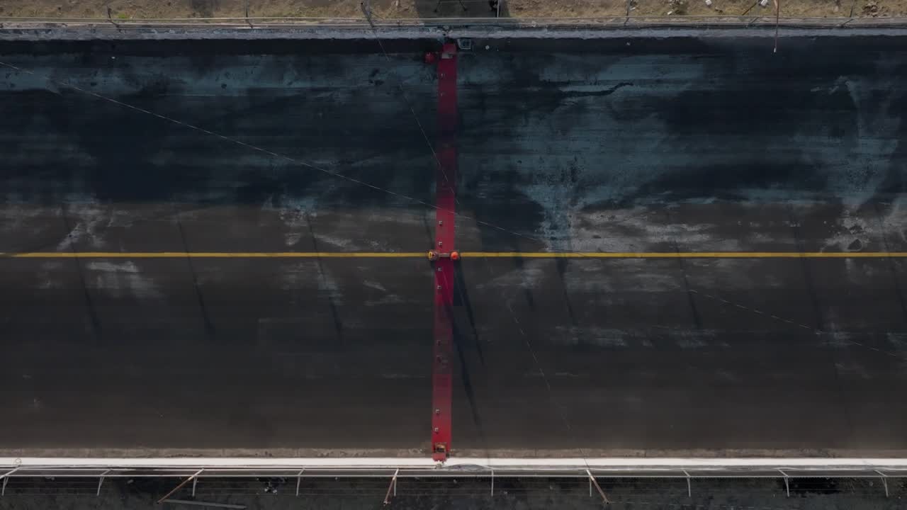 SLOW MOTION DRONE SHOT OF A DRAG RACE FINISH LINE