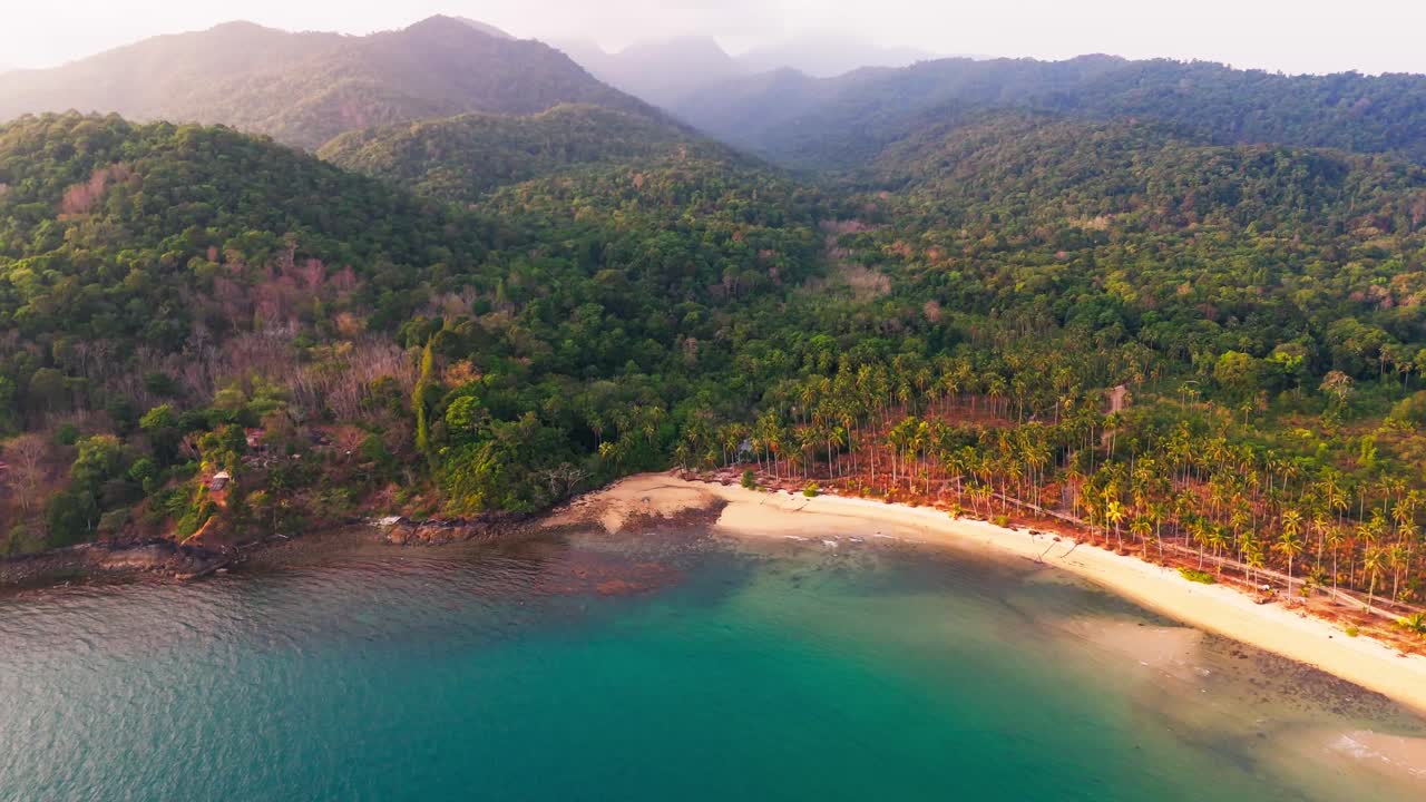 Aerial of Koh Chang island in Thailand drone fly above scenic lonely tropical secluded beach paradise