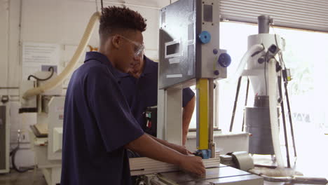 Carpenter-And-Male-Apprentice-Using-Jigsaw-Shot-On-R3D