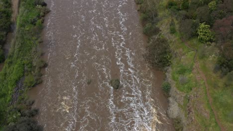 aerial top down rapids flowing downstream after heavy rain event