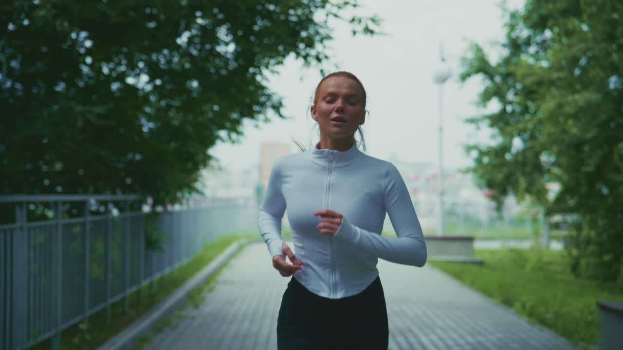 Woman running outdoors in a park