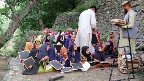 providing blackboards to girls in a remote school