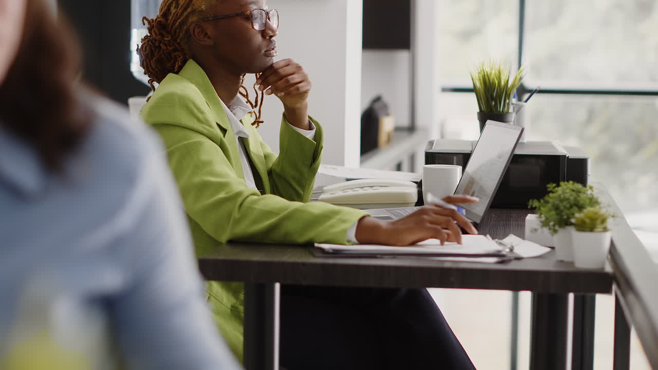 Businesswoman working in the office with colleagues