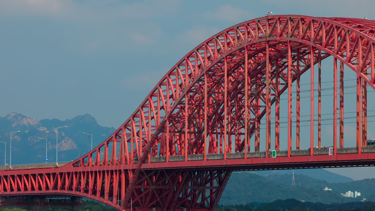 Red Arch Bridge over Mountains