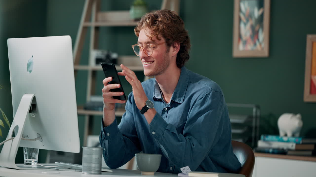 Man using smartphone in home office